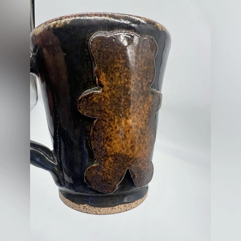Handmade studio pottery mug with rustic bear design